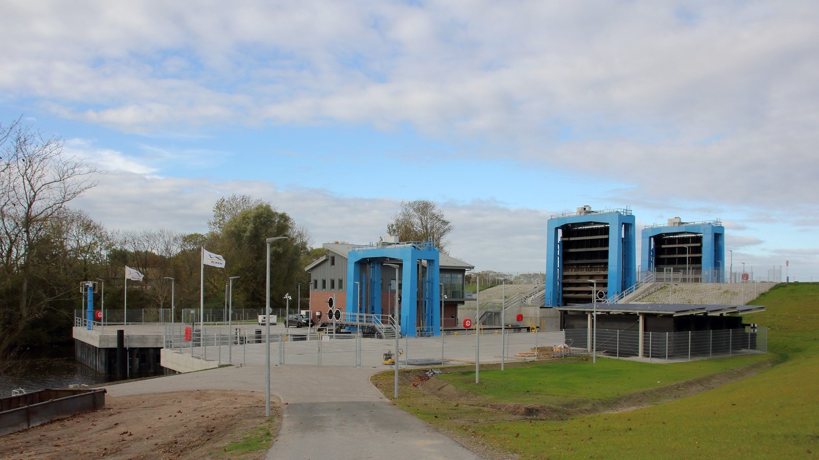 The modern Hadelner Kanalschleuse lock in Otterndorf with blue lock gates